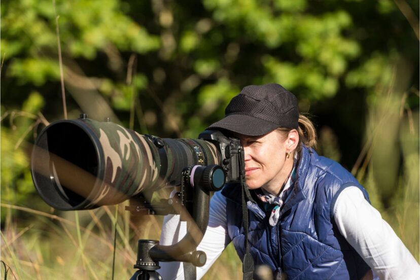 Image of photographer using a tripod suitable for Wildlife Photography